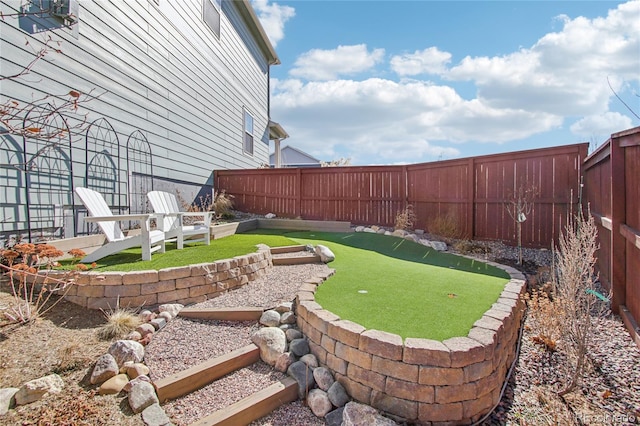 view of yard with a fenced backyard