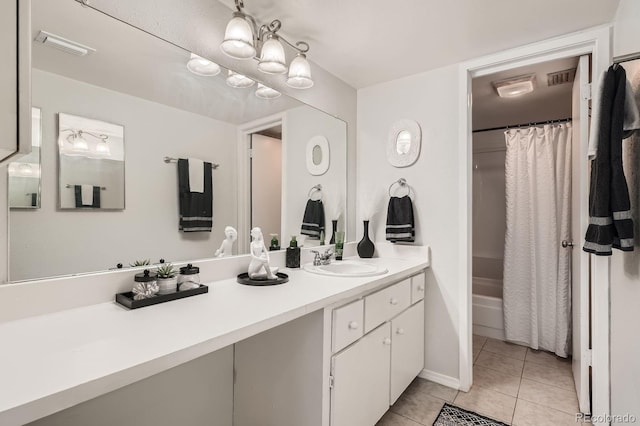 bathroom with visible vents, vanity, and tile patterned floors