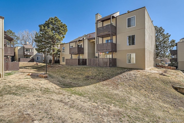 view of property with a residential view and fence