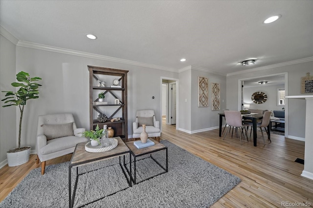 living area featuring recessed lighting, wood finished floors, baseboards, and ornamental molding