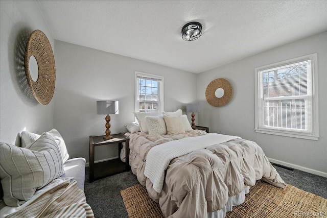 carpeted bedroom with baseboards