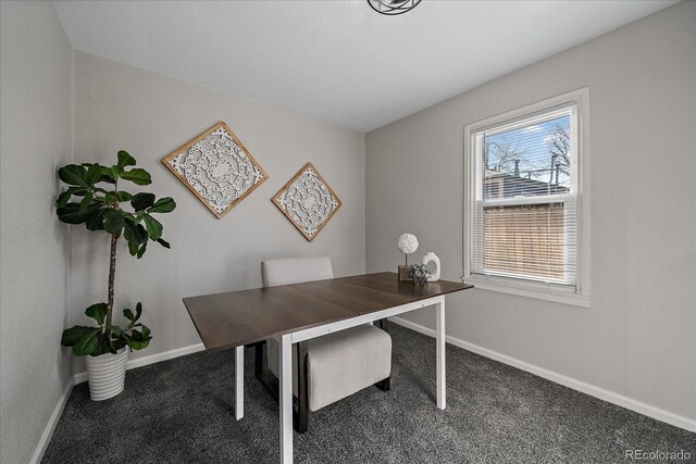 carpeted office featuring baseboards