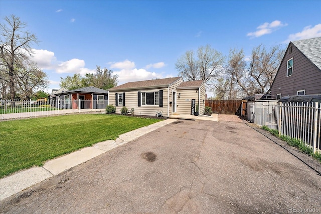 view of front of property with fence and a front yard