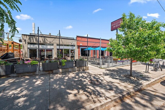 view of building exterior with fence