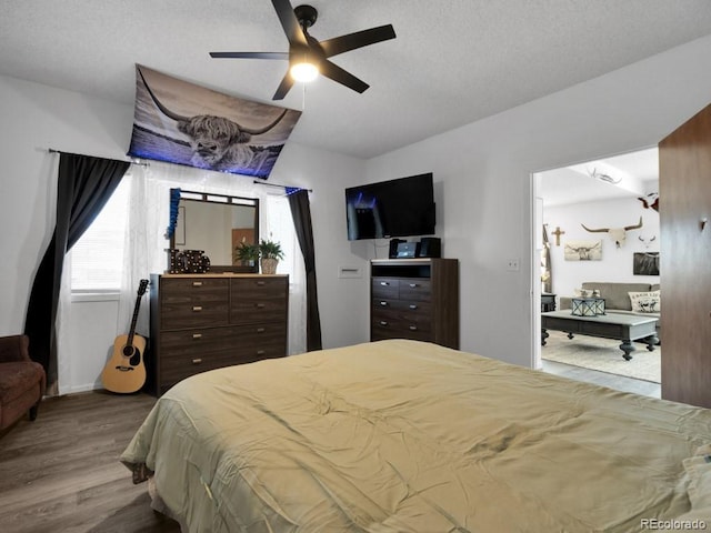 317 Adams Ave, Akron, CO 80720 - bedroom featuring wood-type flooring and ceiling fan