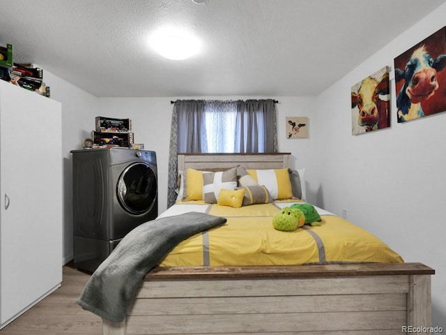 317 Adams Ave, Akron, CO 80720 - bedroom featuring a textured ceiling and light wood-type flooring