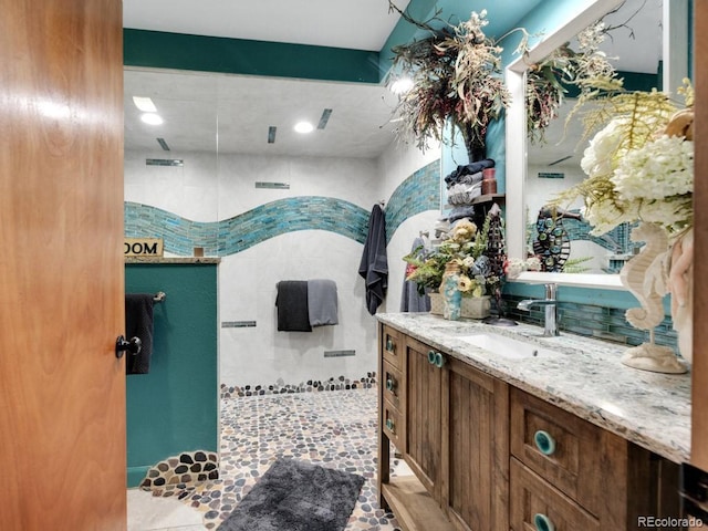 317 Adams Ave, Akron, CO 80720 - bathroom featuring vanity and walk in shower