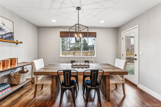 dining space with dark hardwood / wood-style floors