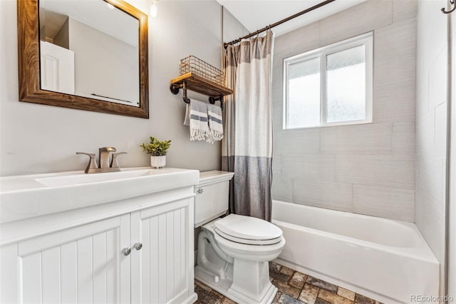 full bathroom featuring vanity, toilet, and shower / tub combo