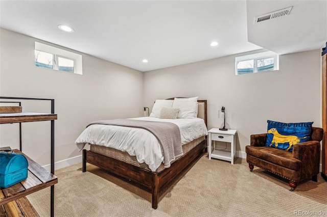 bedroom featuring light colored carpet