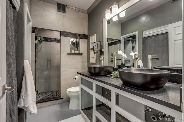 bathroom with vanity, toilet, walk in shower, and ornamental molding