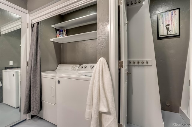 washroom with washer and clothes dryer