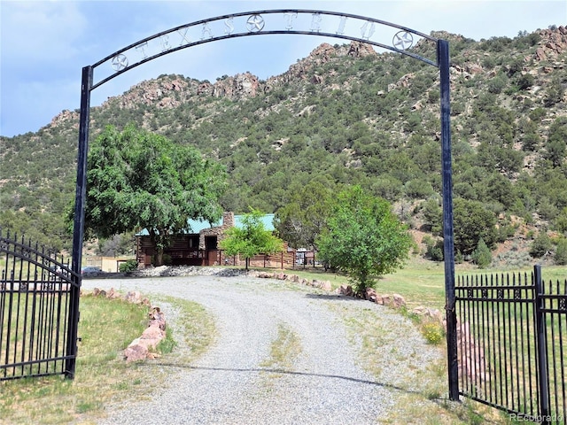 24938 US Highway 50, Cotopaxi, CO 81223 - view of dirt / gravel driveway with a gated entry