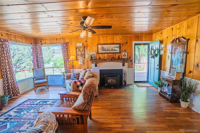24938 US Highway 50, Cotopaxi, CO 81223 - living area with wooden ceiling, wood finished floors, wooden walls, and ceiling fan