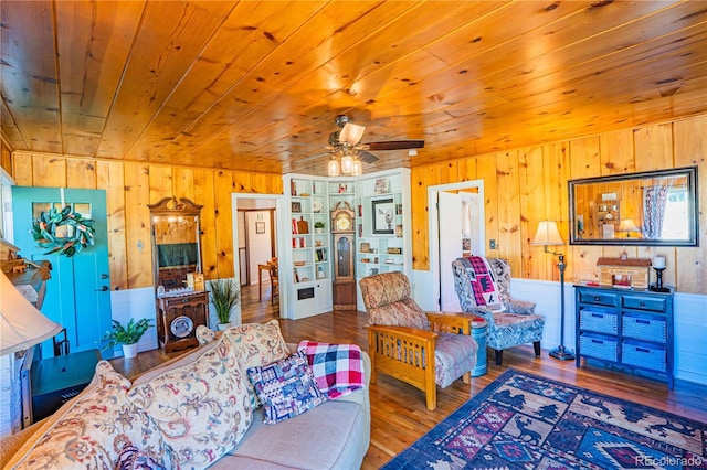 24938 US Highway 50, Cotopaxi, CO 81223 - living area with wood walls, hardwood / wood-style floors, wood ceiling, and a ceiling fan
