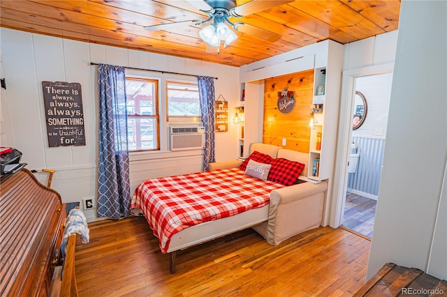24938 US Highway 50, Cotopaxi, CO 81223 - bedroom featuring wood-type flooring, cooling unit, wooden ceiling, and ceiling fan
