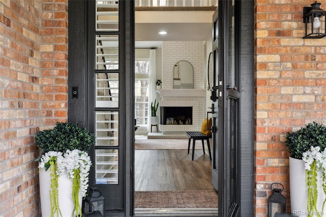 view of exterior entry with brick siding