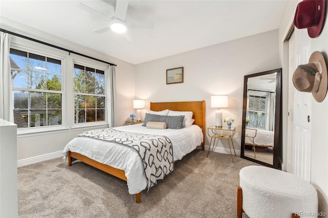 bedroom with carpet, baseboards, and ceiling fan