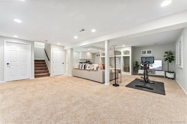 exercise room with recessed lighting, light carpet, and visible vents