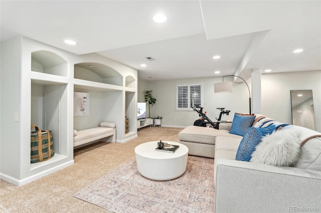 living area with carpet, visible vents, baseboards, and recessed lighting