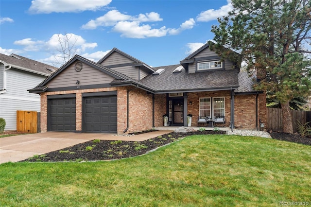 view of front of house featuring a front lawn, concrete driveway, brick siding, and fence