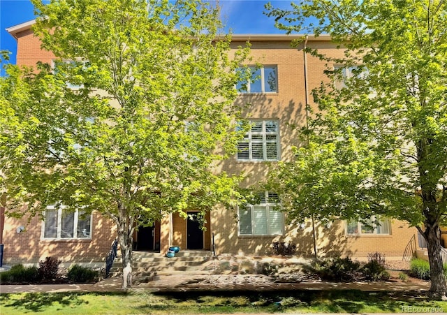7525 E 1st Pl Unit 1010, Denver, CO 80230 - obstructed view of property featuring brick siding