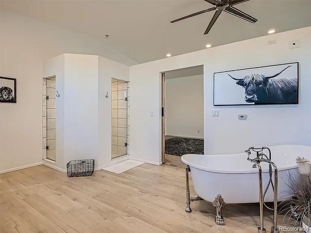 9910 Ammons Cir, Westminster, CO 80021 - bathroom featuring a freestanding bath, recessed lighting, a ceiling fan, and wood finished floors