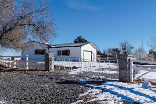 9910 Ammons Cir, Westminster, CO 80021 - view of front of property with a garage and a fenced front yard