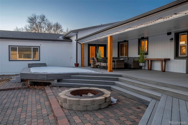 9910 Ammons Cir, Westminster, CO 80021 - back of house with an outdoor living space with a fire pit, a jacuzzi, a deck, and a patio