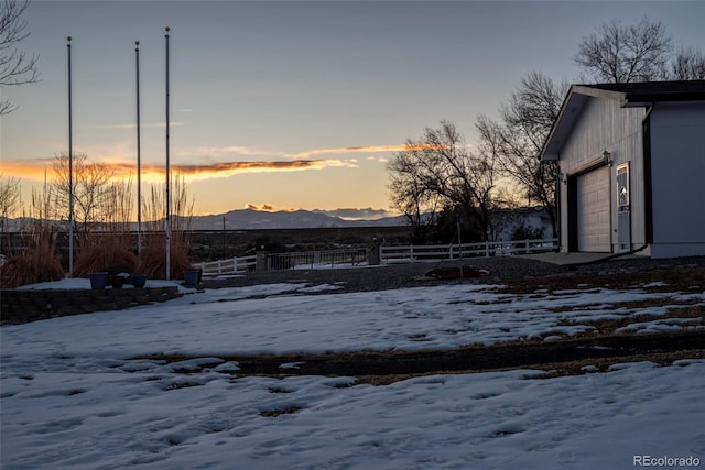 9910 Ammons Cir, Westminster, CO 80021 - yard layered in snow with a mountain view and fence