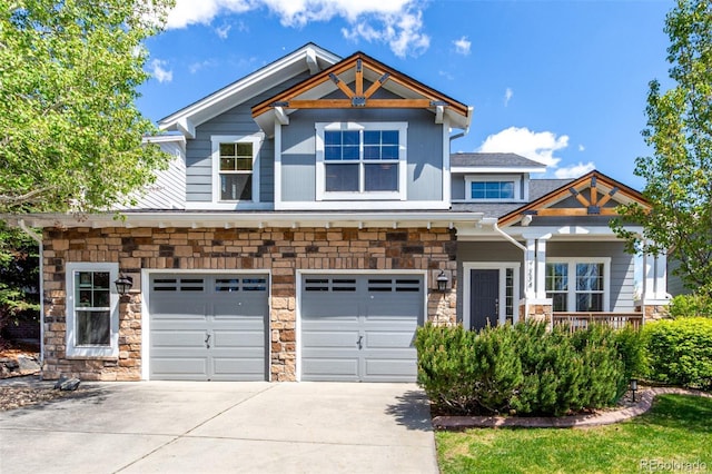 7234 S Kellerman Way, Aurora, CO 80016 - craftsman-style house featuring concrete driveway, stone siding, a porch, and an attached garage
