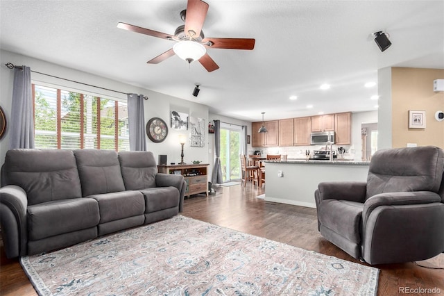 7234 S Kellerman Way, Aurora, CO 80016 - living room with a ceiling fan, dark wood finished floors, and recessed lighting