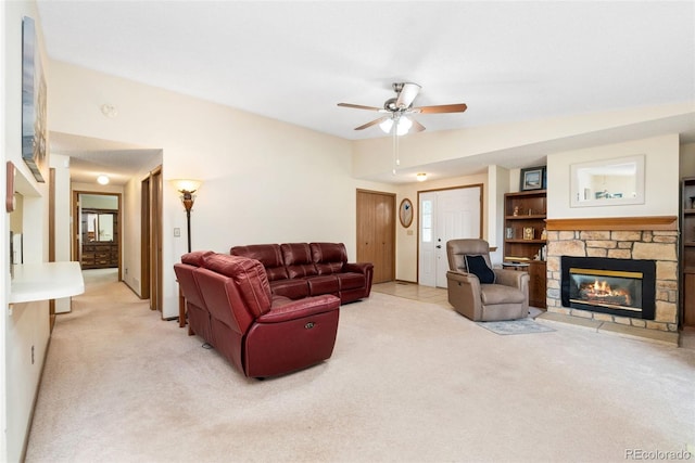 8404 Everett Way Unit A, Arvada, CO 80005 - living area with light carpet, ceiling fan, and a fireplace