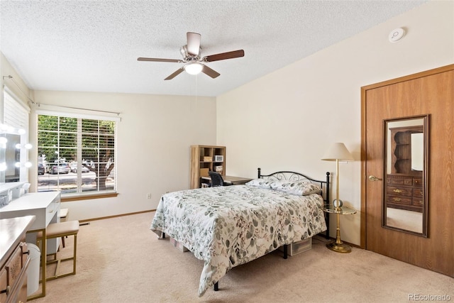 8404 Everett Way Unit A, Arvada, CO 80005 - bedroom featuring light carpet, a textured ceiling, and a ceiling fan