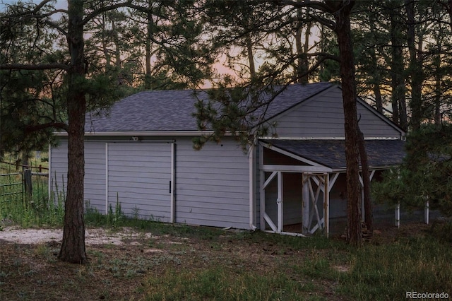 outdoor structure at dusk with a garage