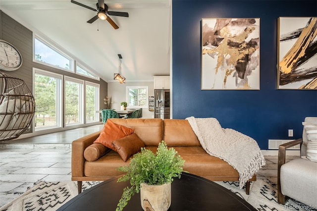 living room with wood-type flooring, vaulted ceiling, and ceiling fan