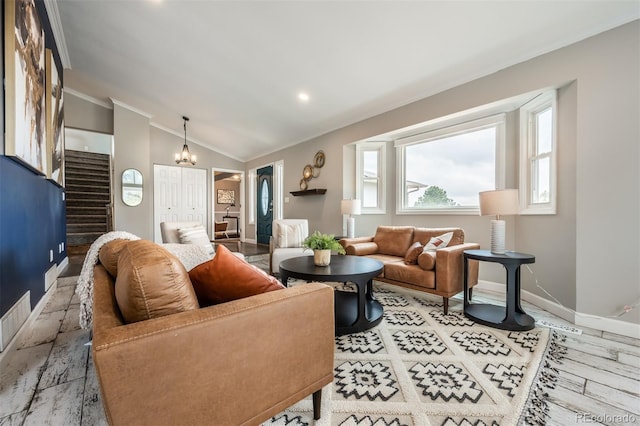 living room featuring crown molding, vaulted ceiling, and a chandelier