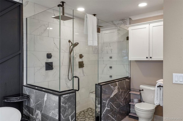 bathroom featuring walk in shower and toilet