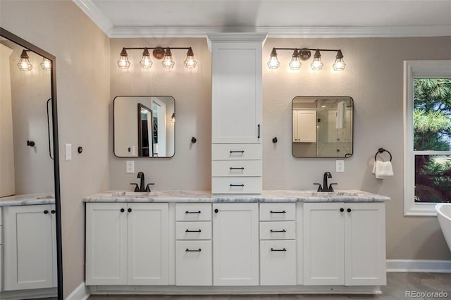 bathroom with vanity and crown molding