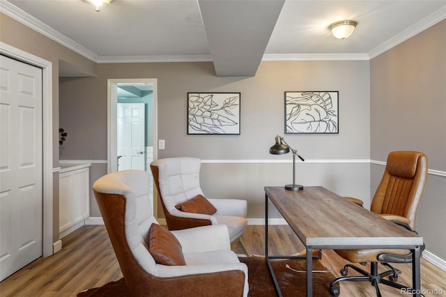 home office featuring ornamental molding and hardwood / wood-style floors