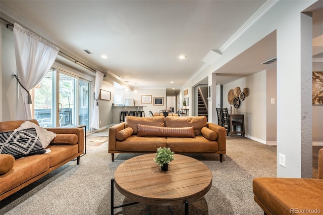 carpeted living room with ornamental molding