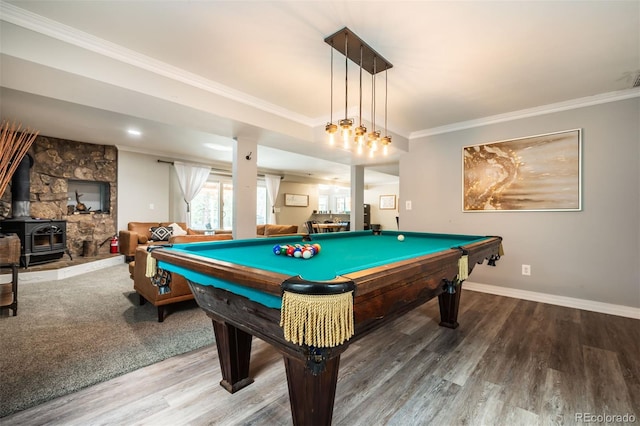 game room featuring hardwood / wood-style flooring, crown molding, pool table, and a wood stove