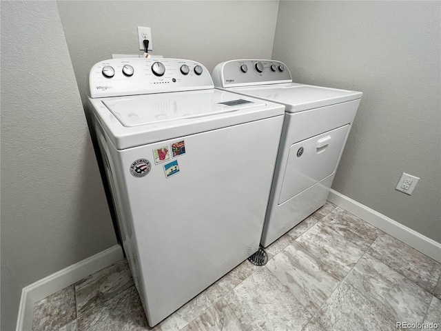 washroom with independent washer and dryer