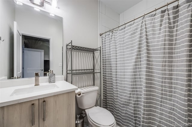 full bathroom featuring toilet and vanity