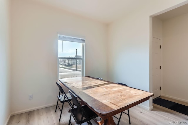 215 N Stewart St, Keenesburg, CO 80643 - dining space featuring light wood-style flooring and baseboards