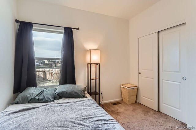 215 N Stewart St, Keenesburg, CO 80643 - carpeted bedroom featuring a closet and baseboards