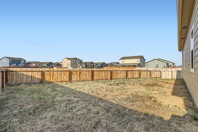 215 N Stewart St, Keenesburg, CO 80643 - fenced backyard featuring a residential view