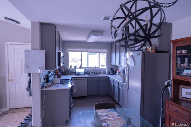 8200 E 8th Ave Unit 1203, Denver, CO 80230 - kitchen with light countertops, appliances with stainless steel finishes, and light wood-style flooring