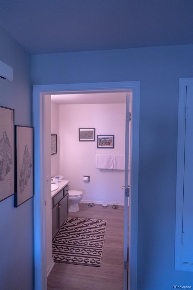 8200 E 8th Ave Unit 1203, Denver, CO 80230 - bathroom with wood finished floors and vanity