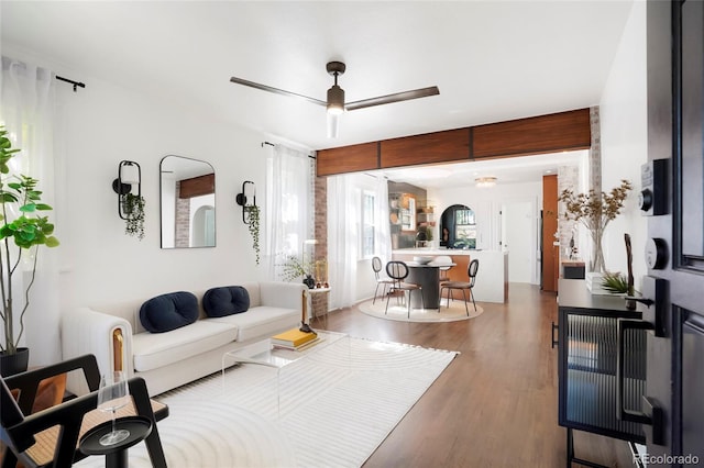 living room featuring hardwood / wood-style flooring and ceiling fan